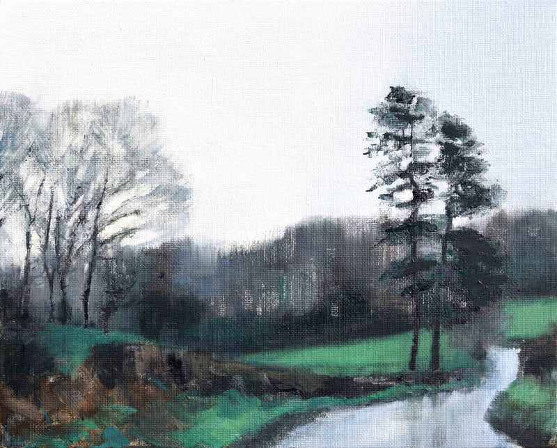 a small oil painting of pine trees in winter with green fields