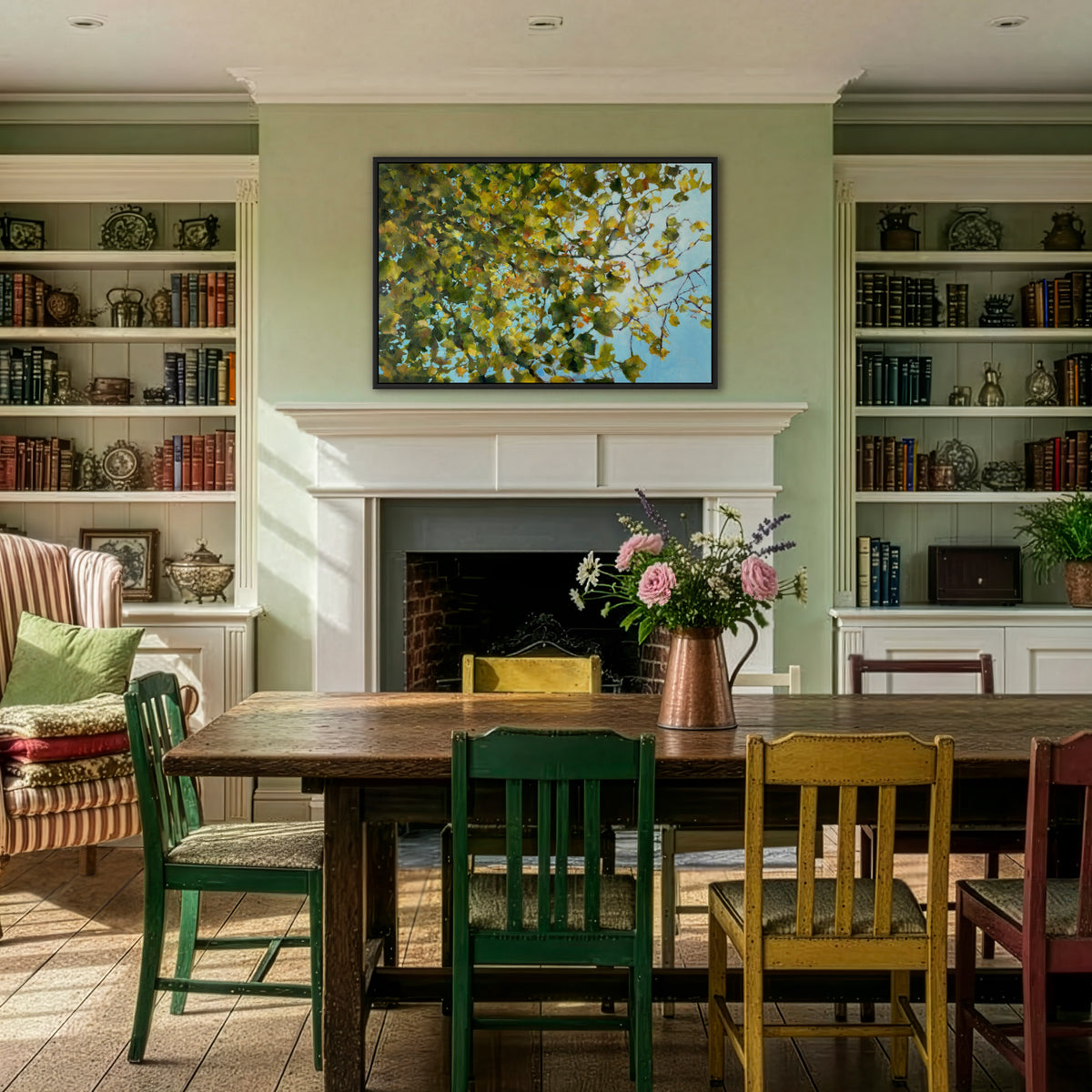 A calming abstract textured oil painting of golden green autumn leaves by Julia Brown in an eclectic period dining room