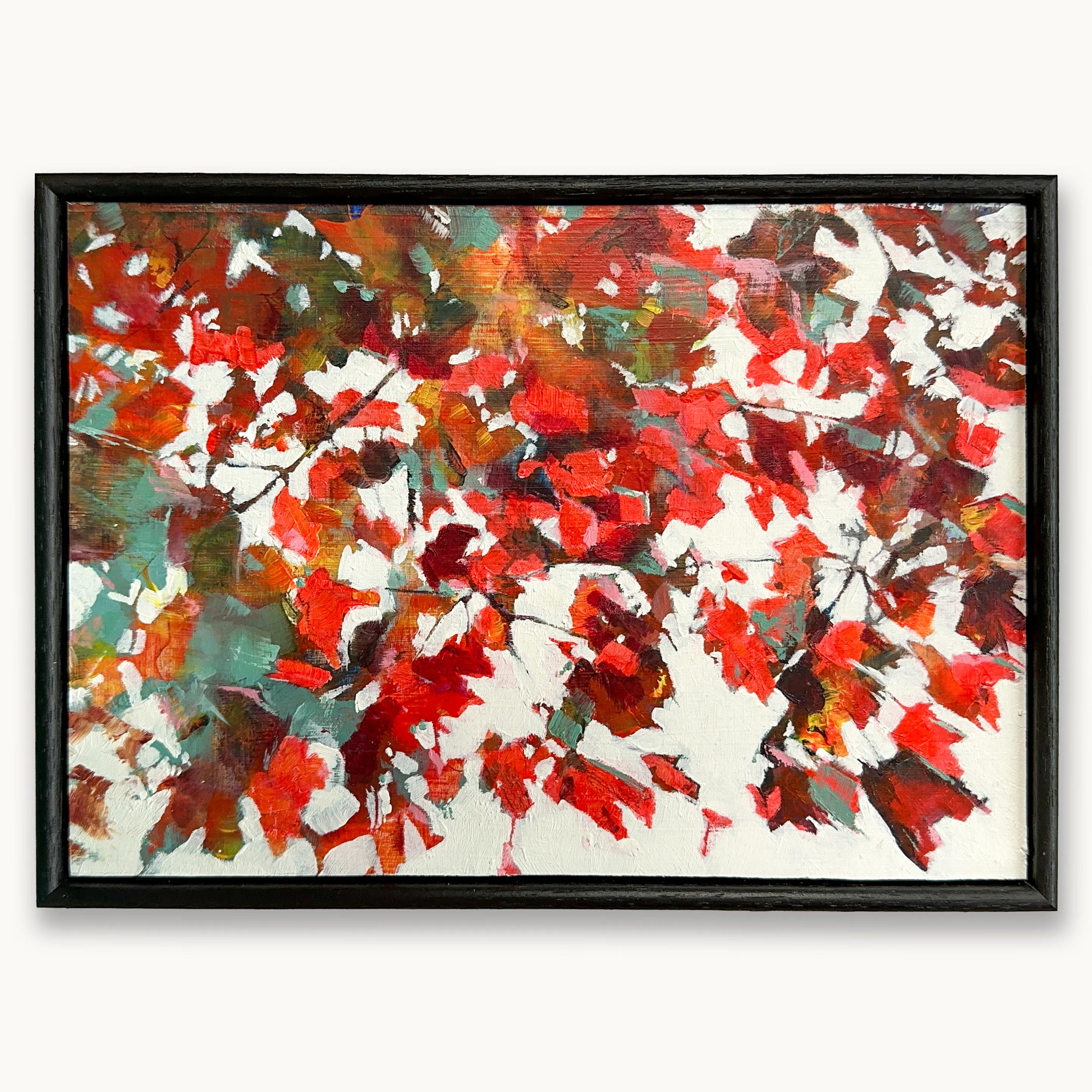 Warm, textured abstract oil painting of rustling maple leaves and broken light, evoking calm and stillness with red, orange, crimson and teal, in a black wood frame