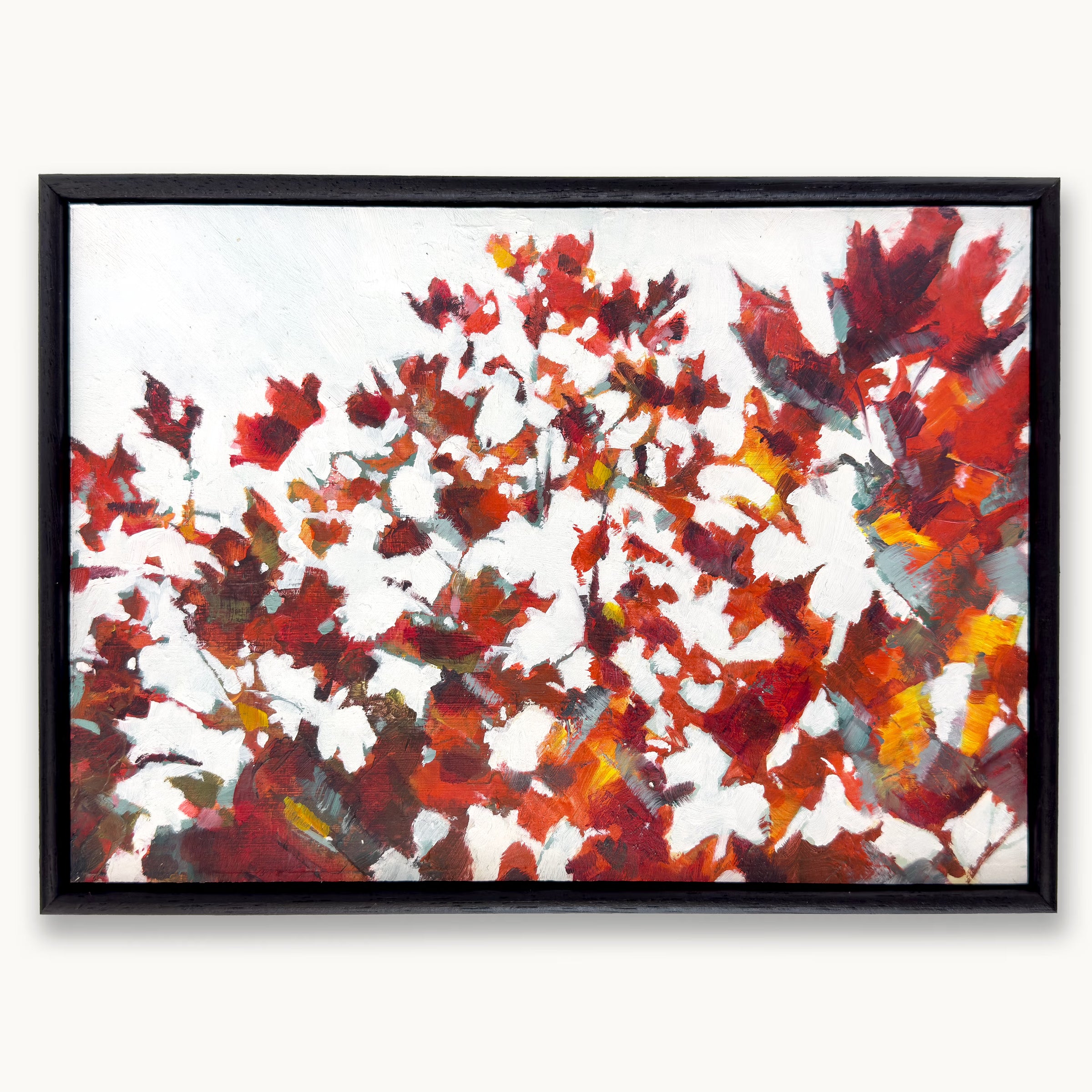 Framed semi-abstract painting of red maple leaves with layers of light and shadow on a grey autumn day by Julia Brown