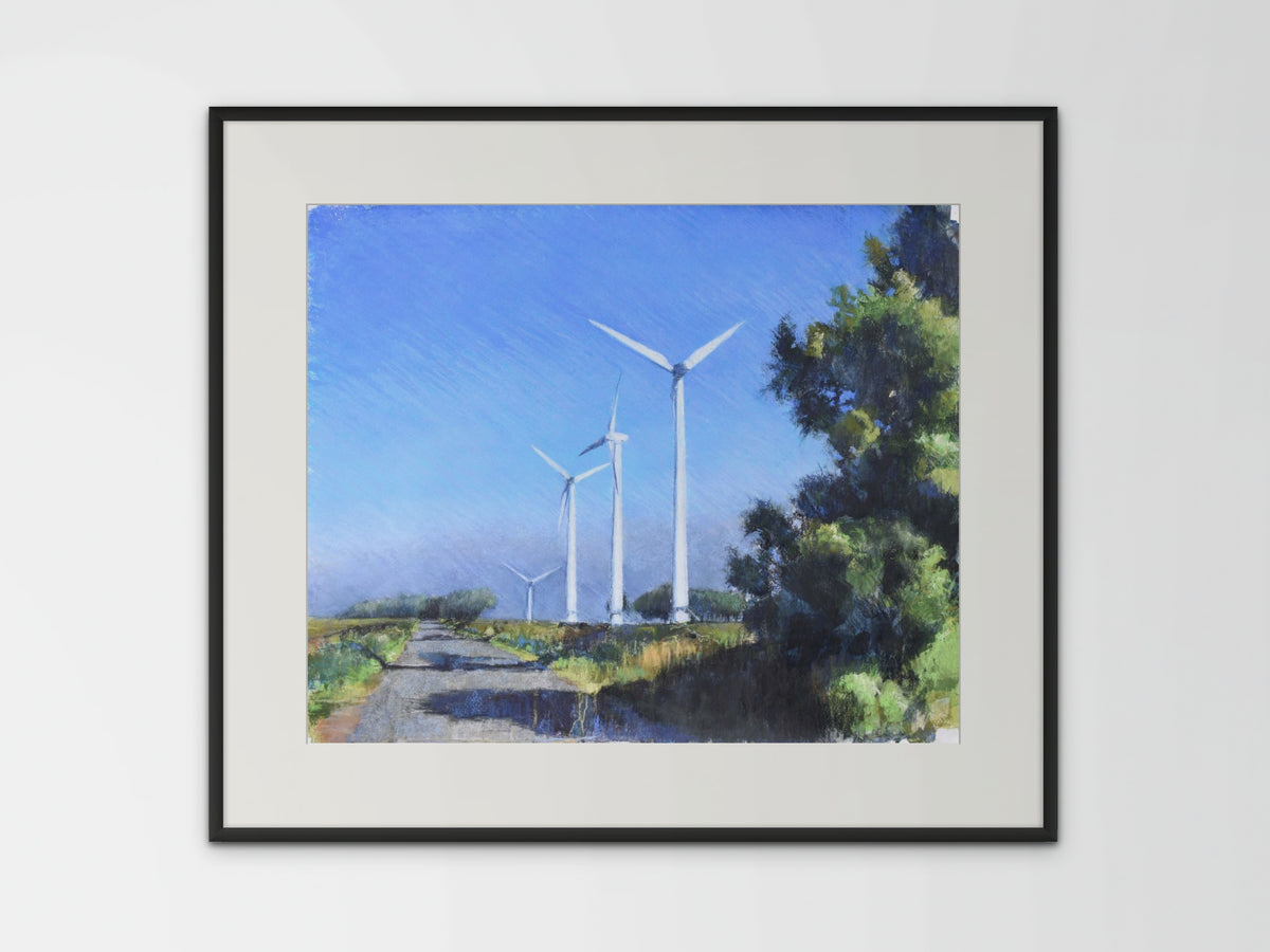 A framed textured landscape mixed media and pastel painting of a sunny summer morning with wind turbines and blue sky by UK artist Julia Brown 