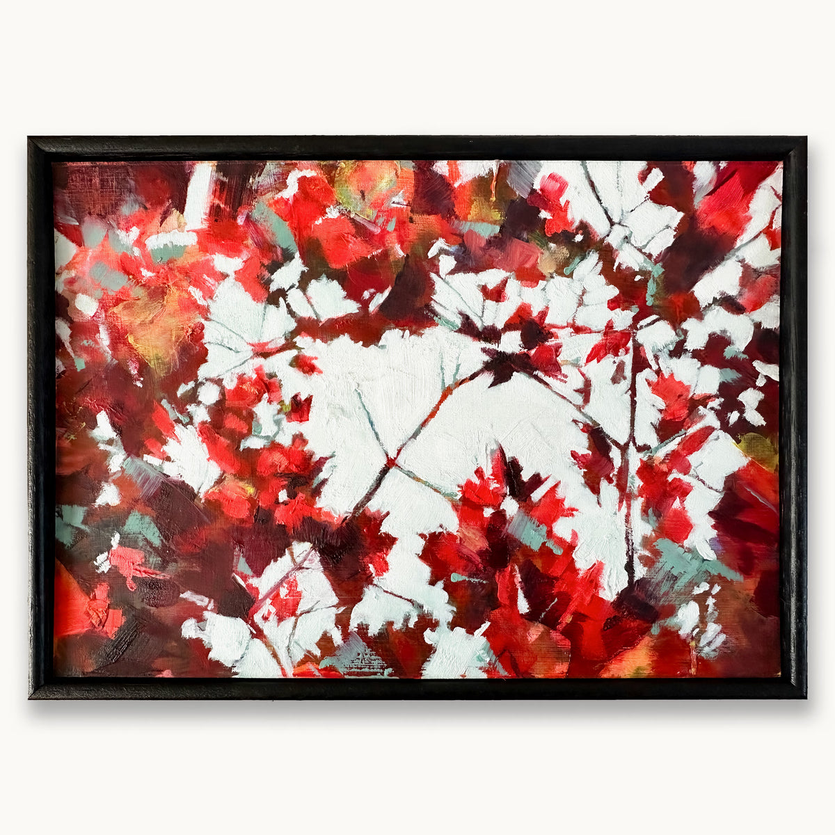An abstract textured oil painting showing glimpses of bright light through branches with red, crimson and and teal maple leaves, in a black wood frame, by Julia Brown